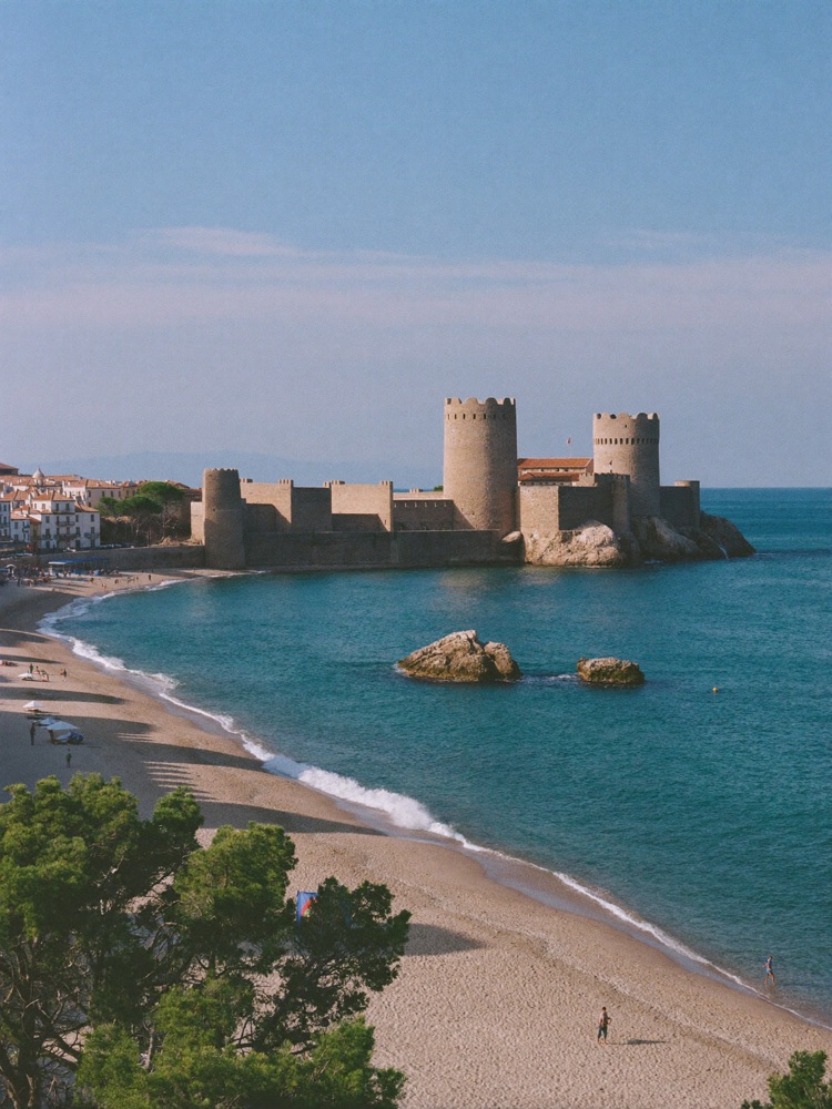 The medieval walled old town of Tossa de Mar above its beach on the Costa Brava