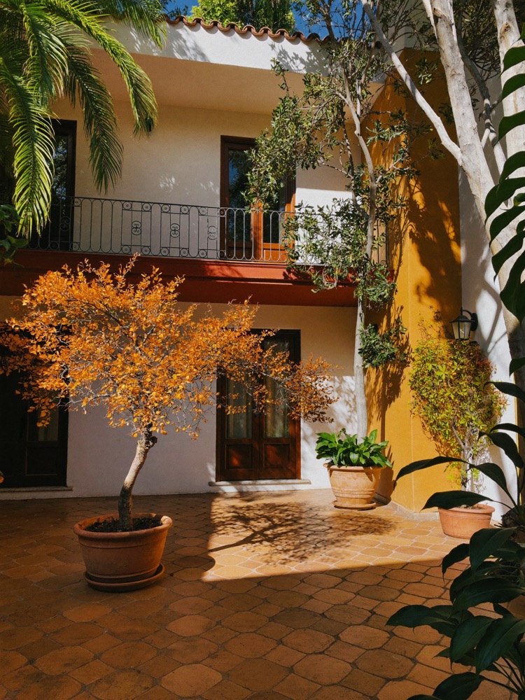 Traditional Spanish courtyard with orange trees and terracotta tiles